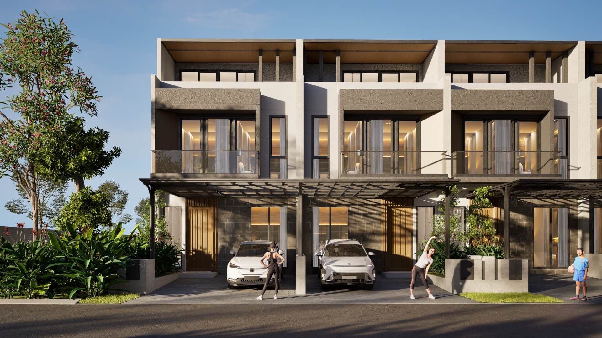 Modern three‑story townhouse complex with glass balconies, parked cars, and people outside under a shaded driveway.